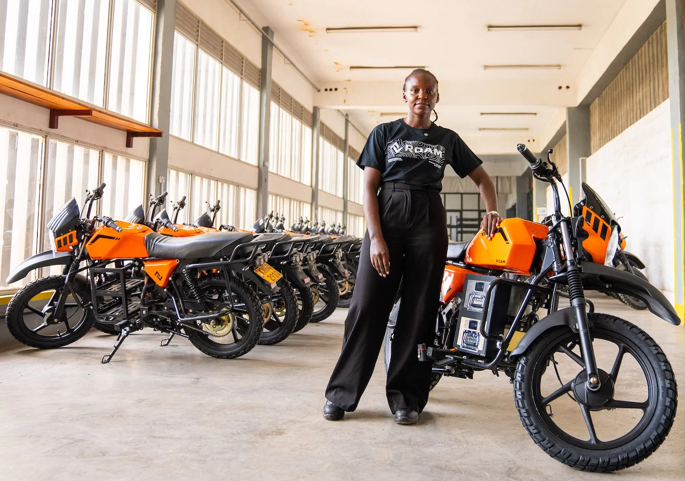 Monicah Mwalo, Roam production manager, with Roam Air electric motorcycles