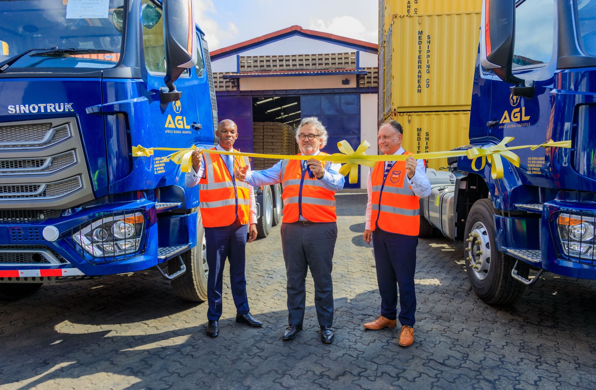 AGL and CFAO representatives at a Sinotruk truck handover in Kenya