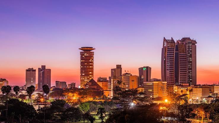 Public service vehicles moving through Nairobi traffic